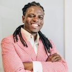 BlackBusinessManInPinkSuit