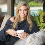 Kristi-Funk-breast-cancer-surgeon,-physician,-author-sitting-holding-mug