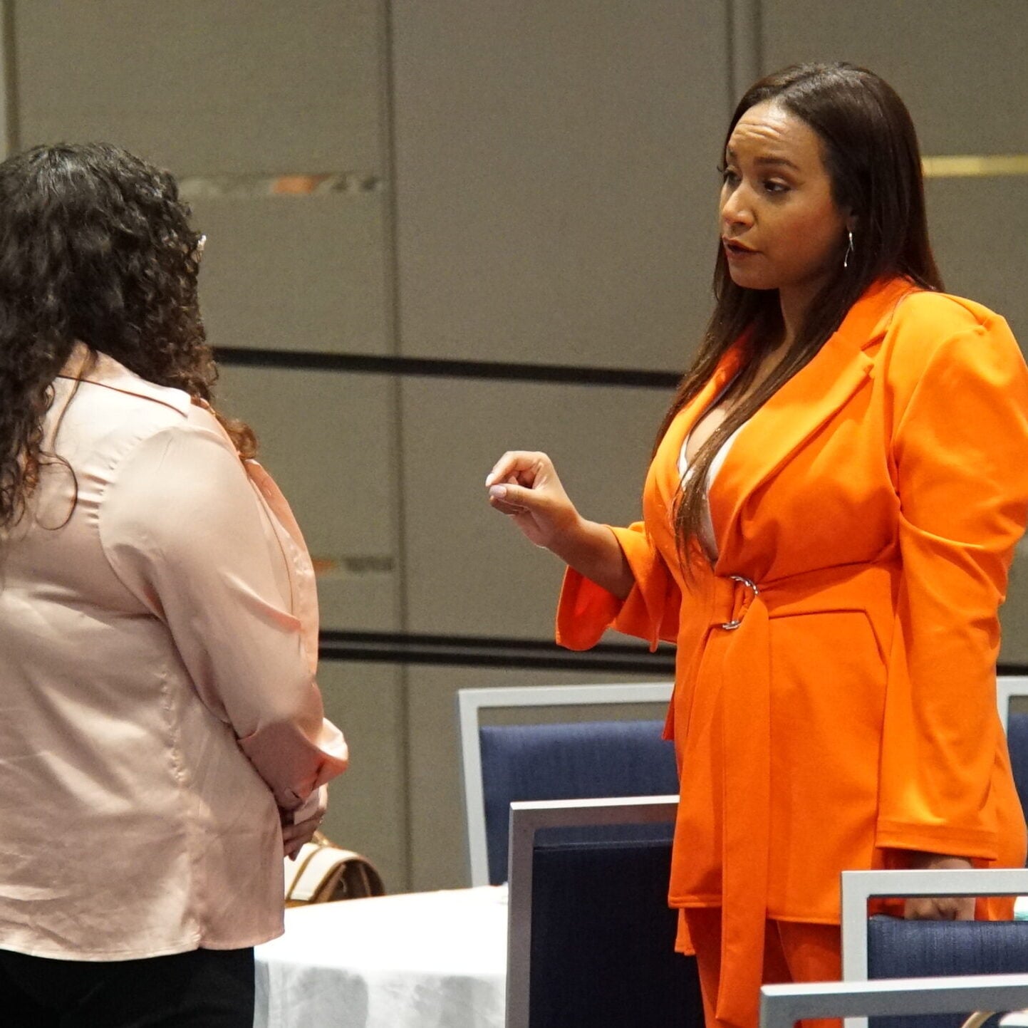 Tamika speaking to an audience member